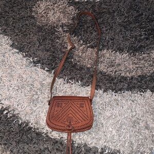 Small tooled leather cross body good cond